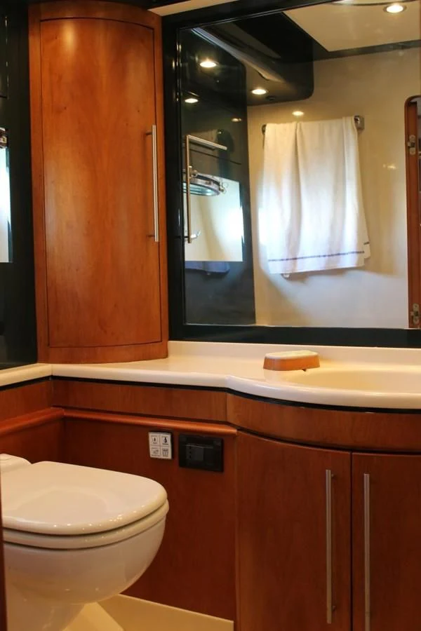 a bathroom with a large mirror aboard MACAMI Yacht for Sale