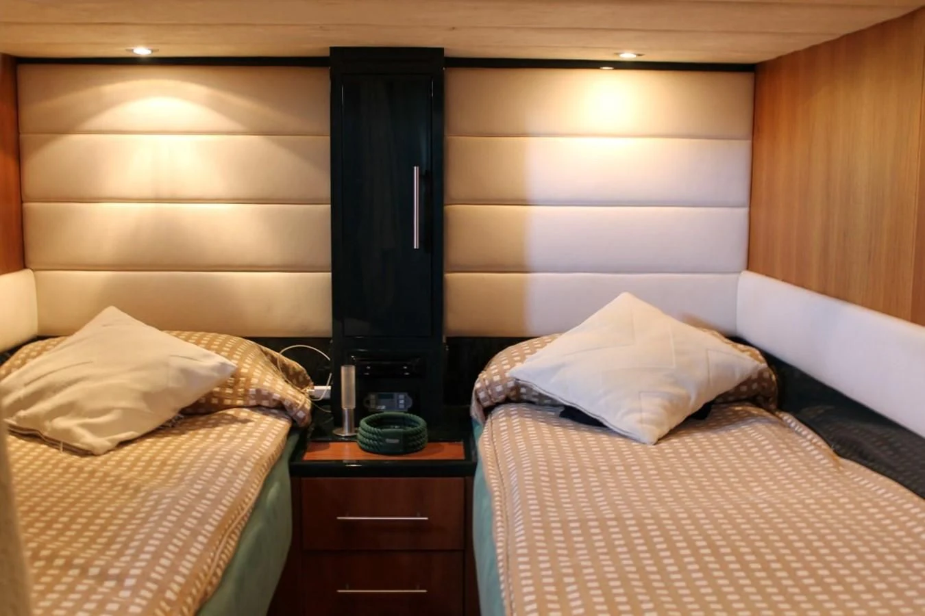 a room with a bed and a television aboard MACAMI Yacht for Sale