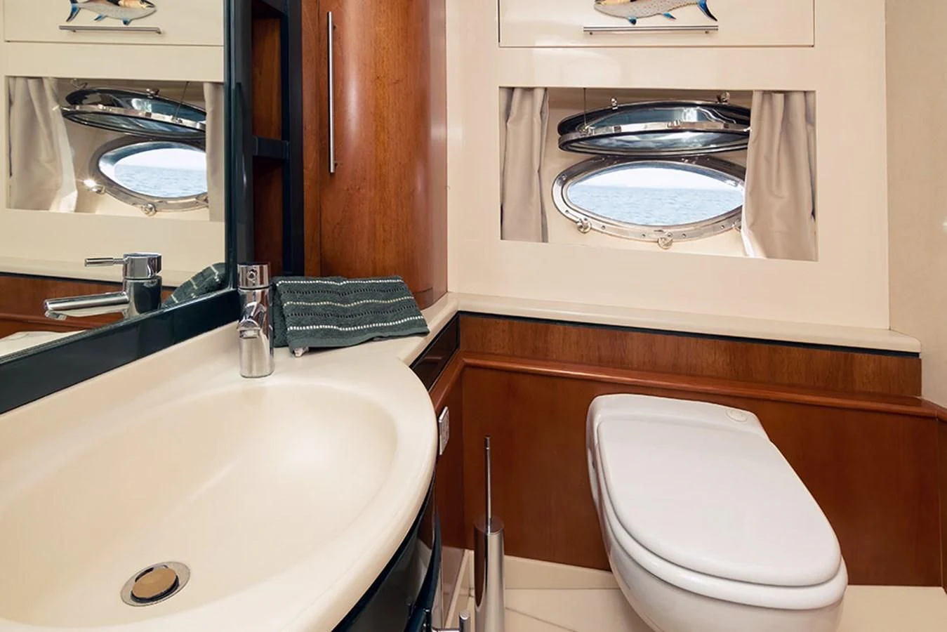 a bathroom with a large mirror aboard MACAMI Yacht for Sale
