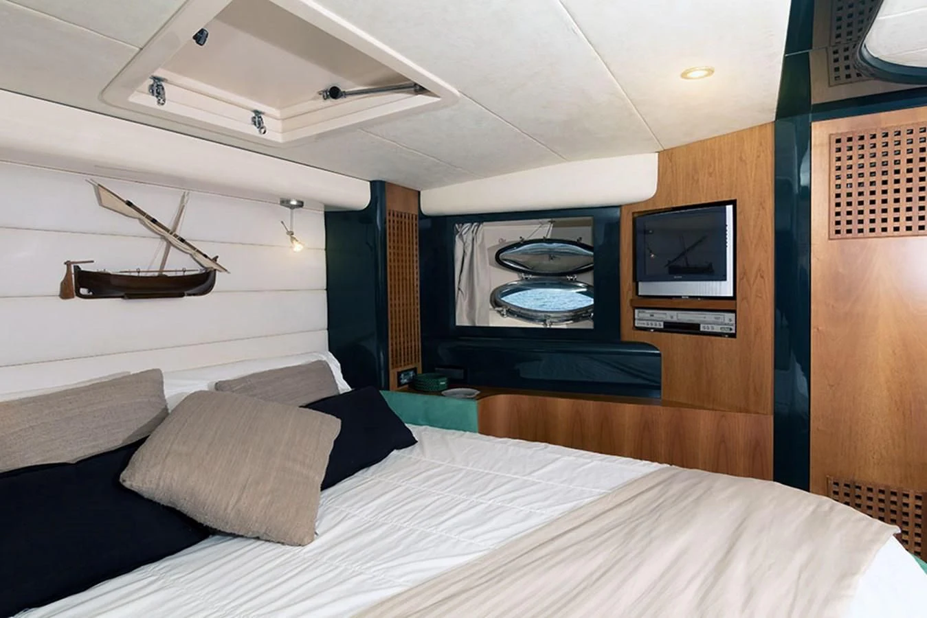 a bedroom with a large bed aboard MACAMI Yacht for Sale