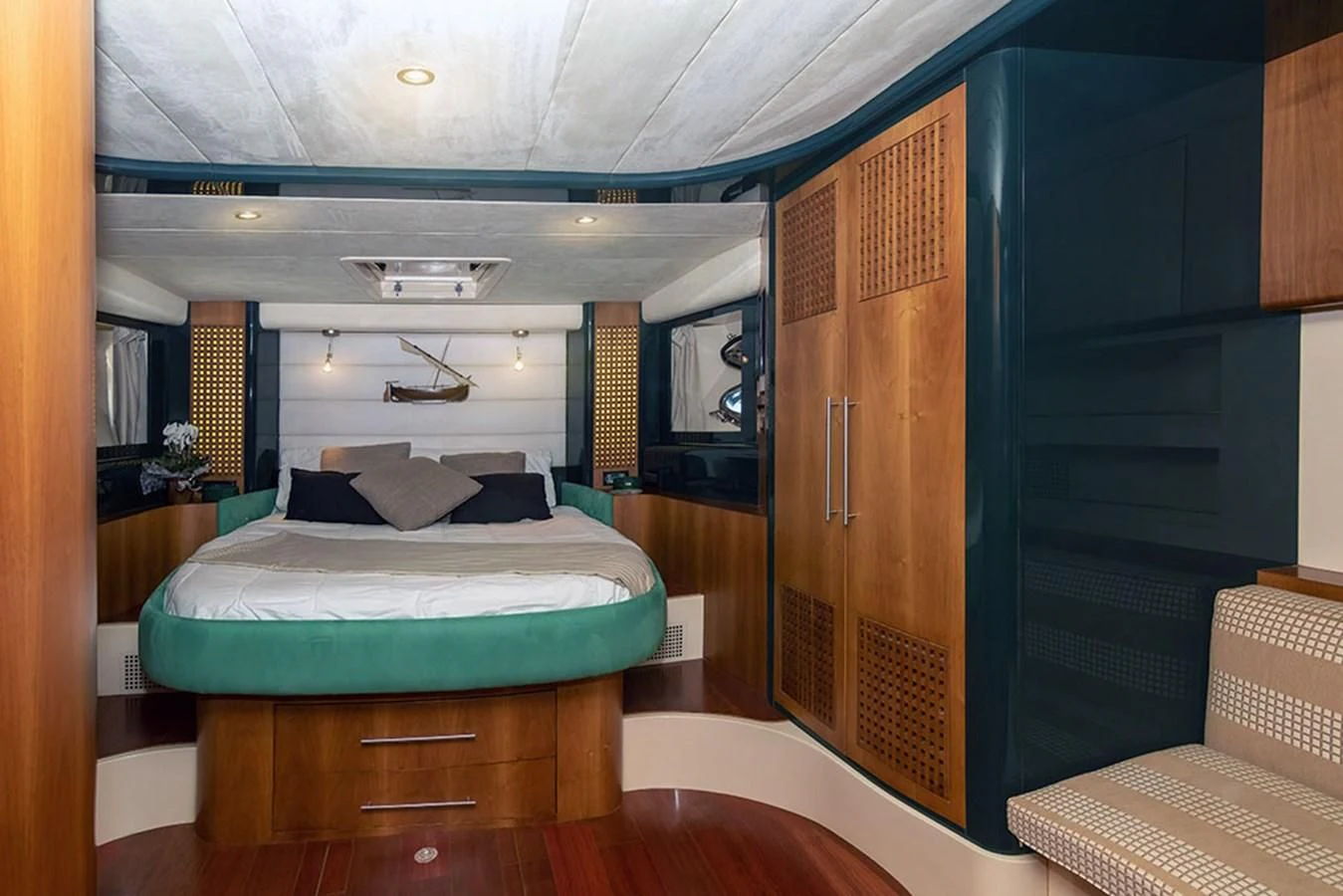 a bedroom with a bed and a closet aboard MACAMI Yacht for Sale