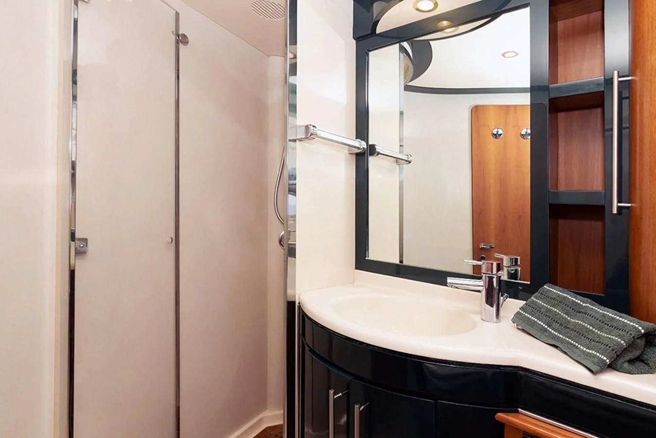a bathroom with a sink and a mirror aboard MACAMI Yacht for Sale