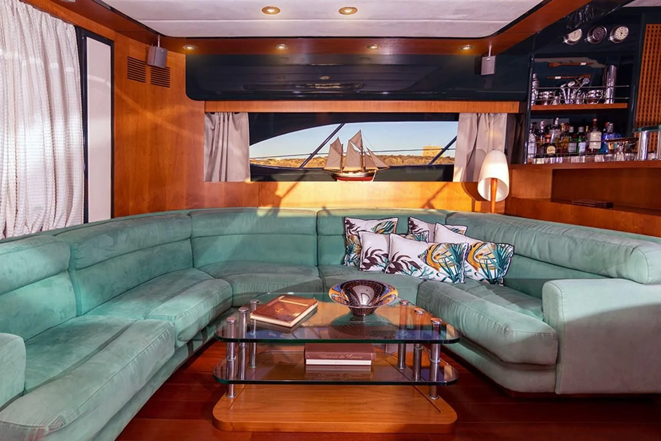 a living room with a couch and coffee table aboard MACAMI Yacht for Sale