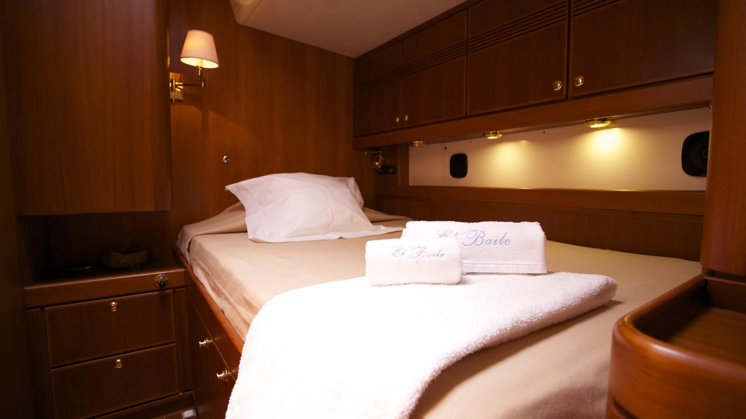 a room with a bed and a desk aboard EL BAILE Yacht for Sale