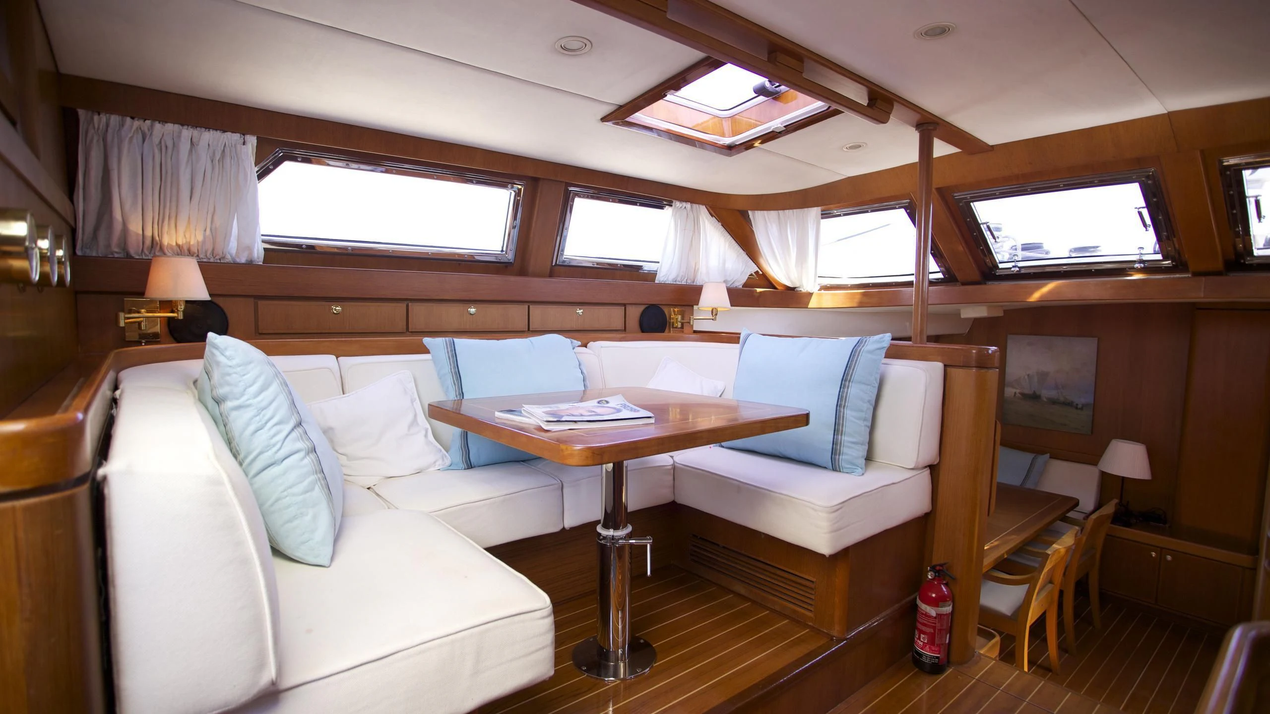 a room with a couch and a table aboard EL BAILE Yacht for Sale