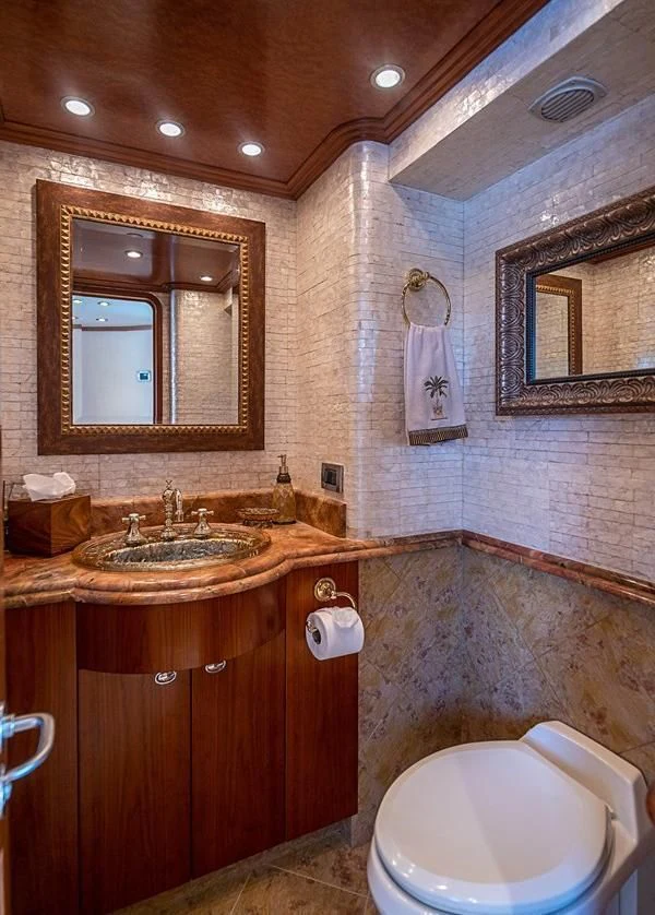 a bathroom with a sink and a toilet aboard KEMOSABE Yacht for Charter