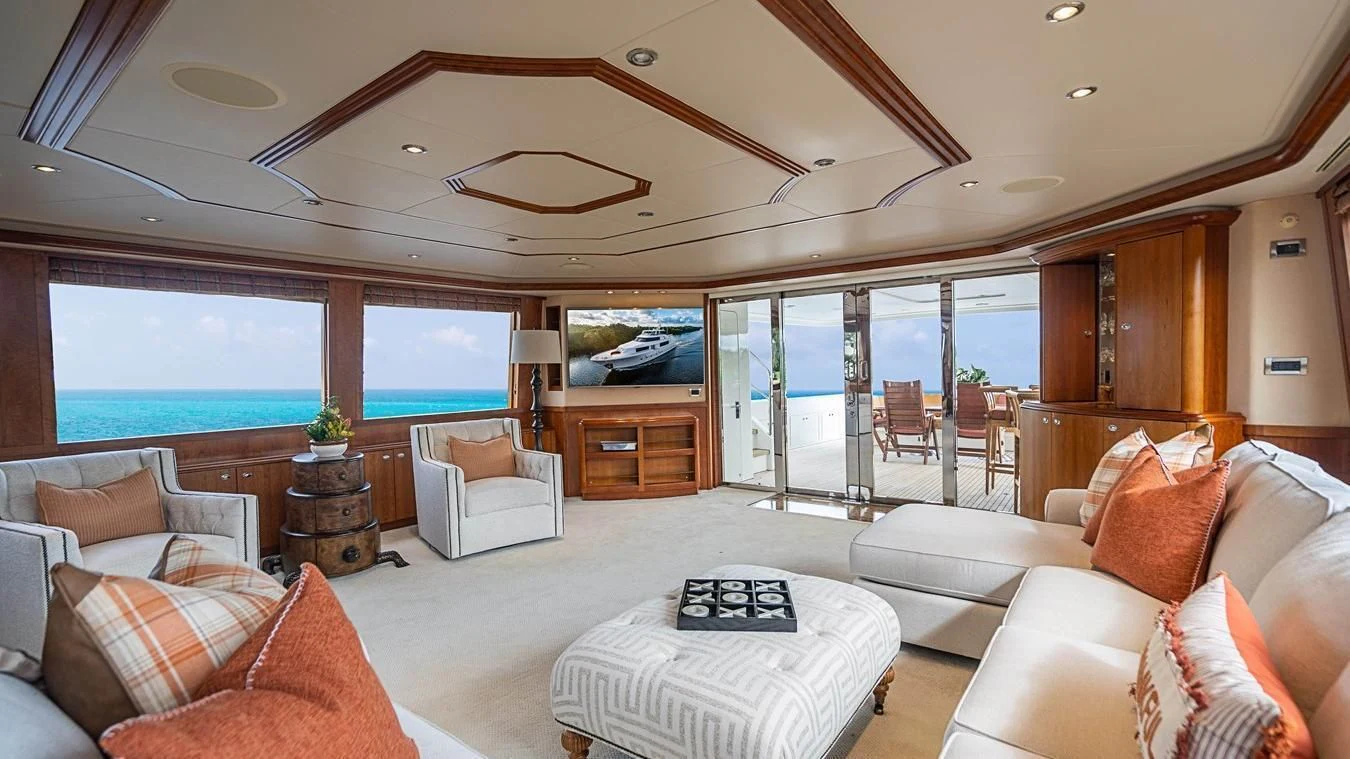 a large living room with a large glass window aboard KEMOSABE Yacht for Charter