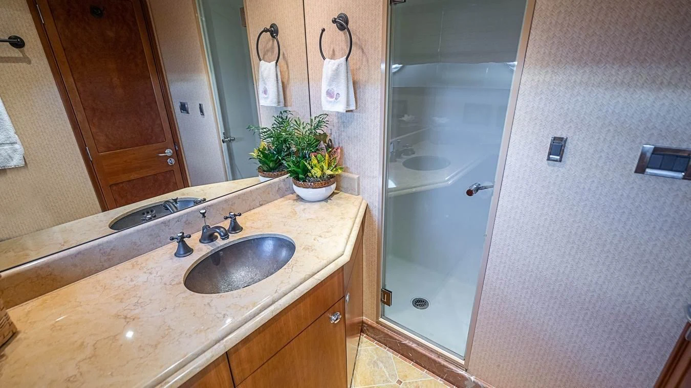 a bathroom with a sink and a mirror aboard KEMOSABE Yacht for Charter