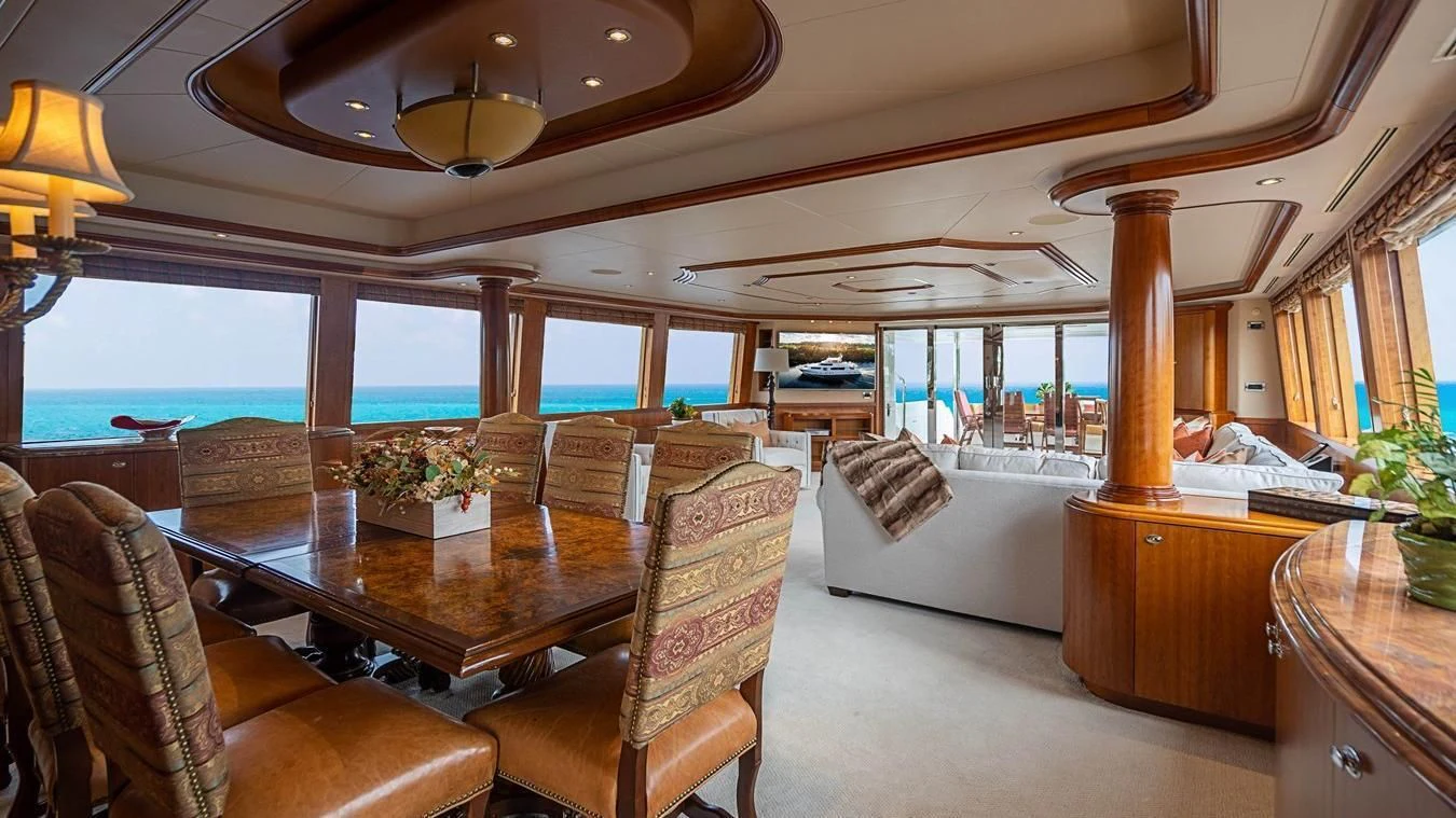 a living room with a large window aboard KEMOSABE Yacht for Charter
