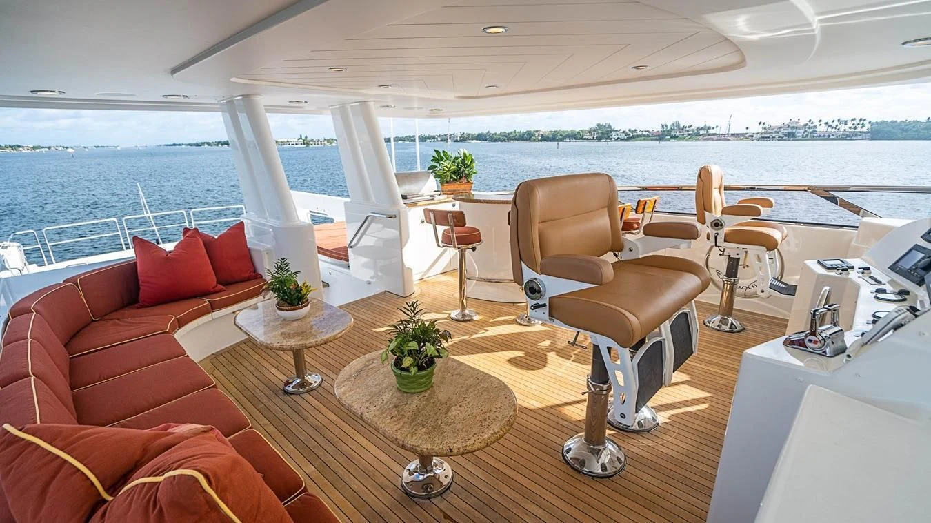 a living room with a large window aboard KEMOSABE Yacht for Charter