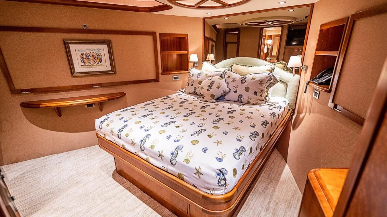 a bed in a room aboard KEMOSABE Yacht for Charter