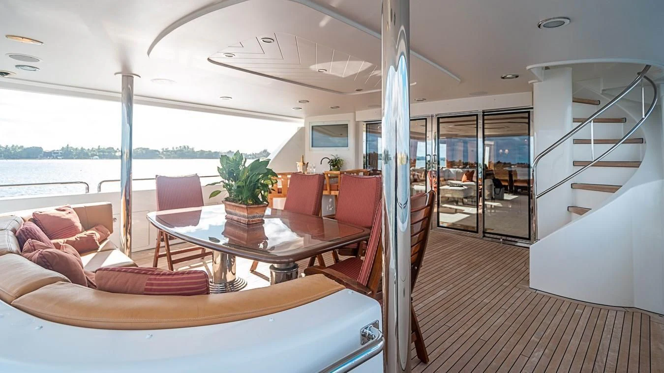 a room with a table and chairs aboard KEMOSABE Yacht for Charter