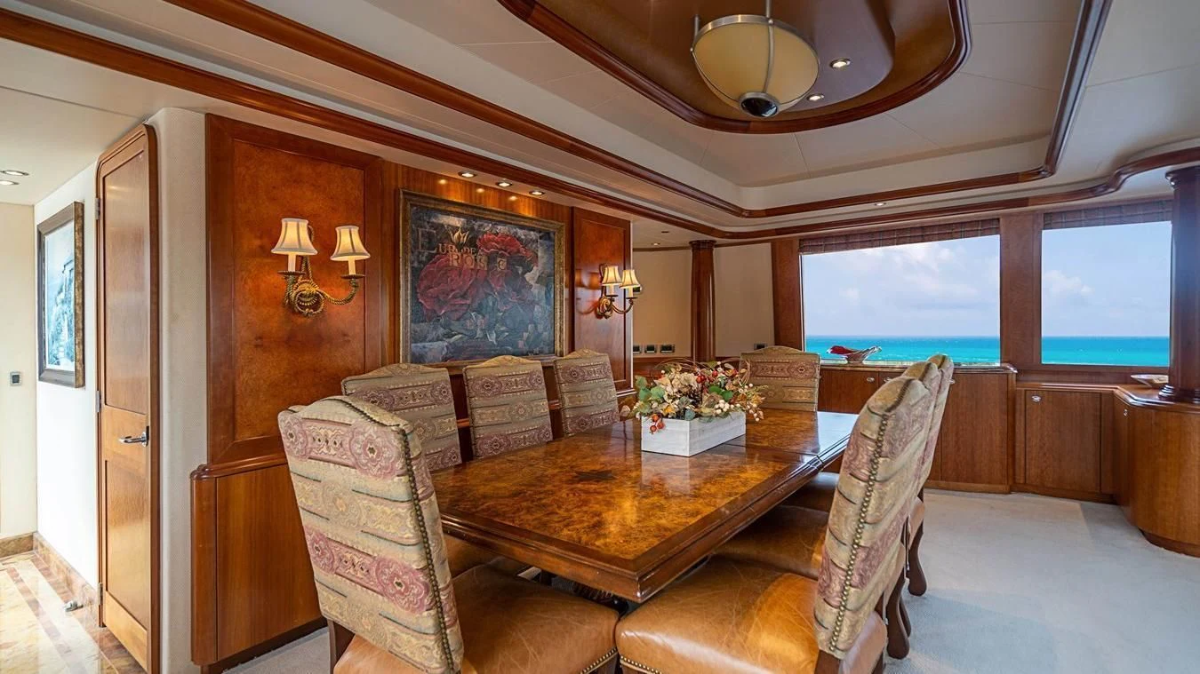a living room with a large window aboard KEMOSABE Yacht for Charter