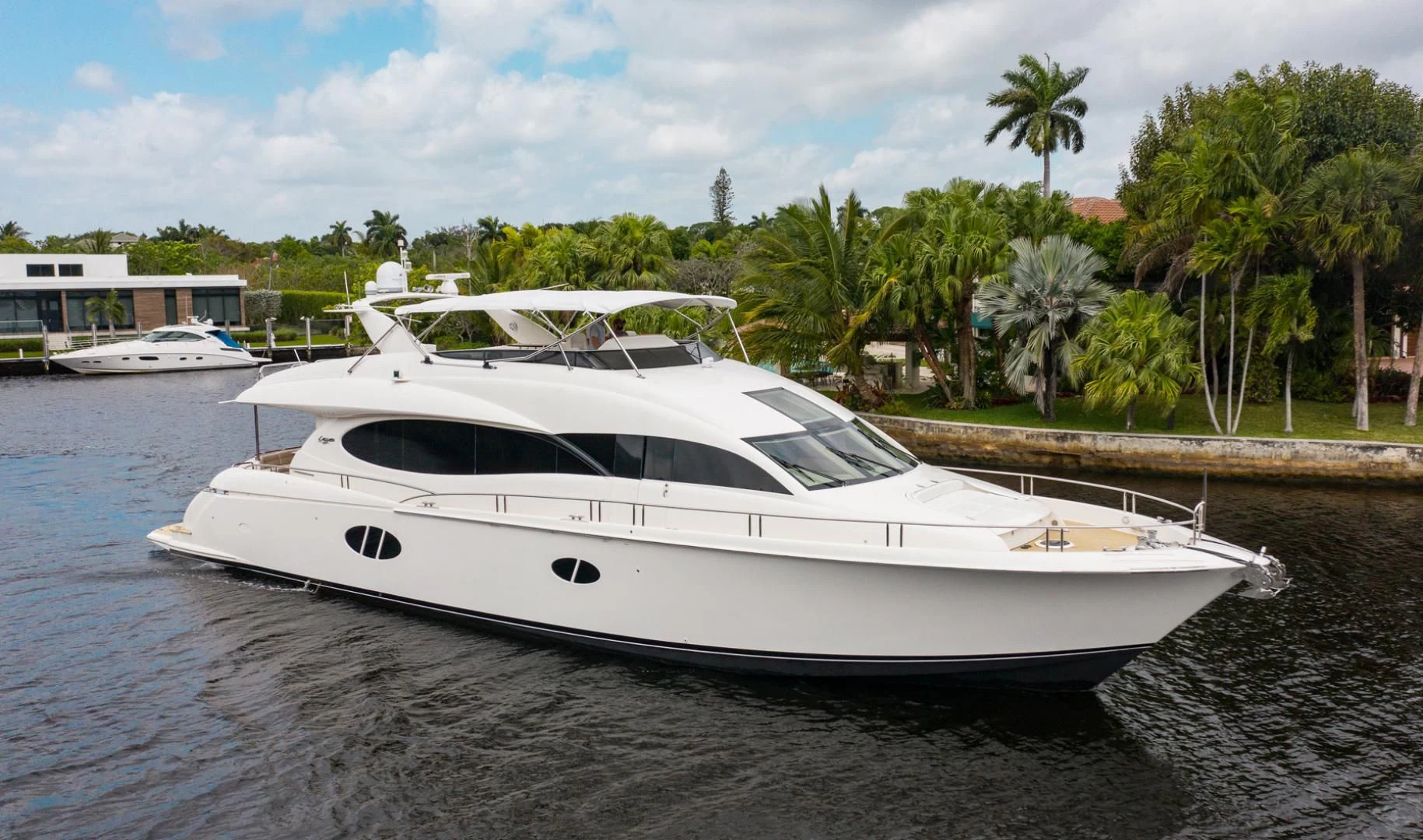 a white boat on a beach aboard 26 NORTH Yacht for Sale
