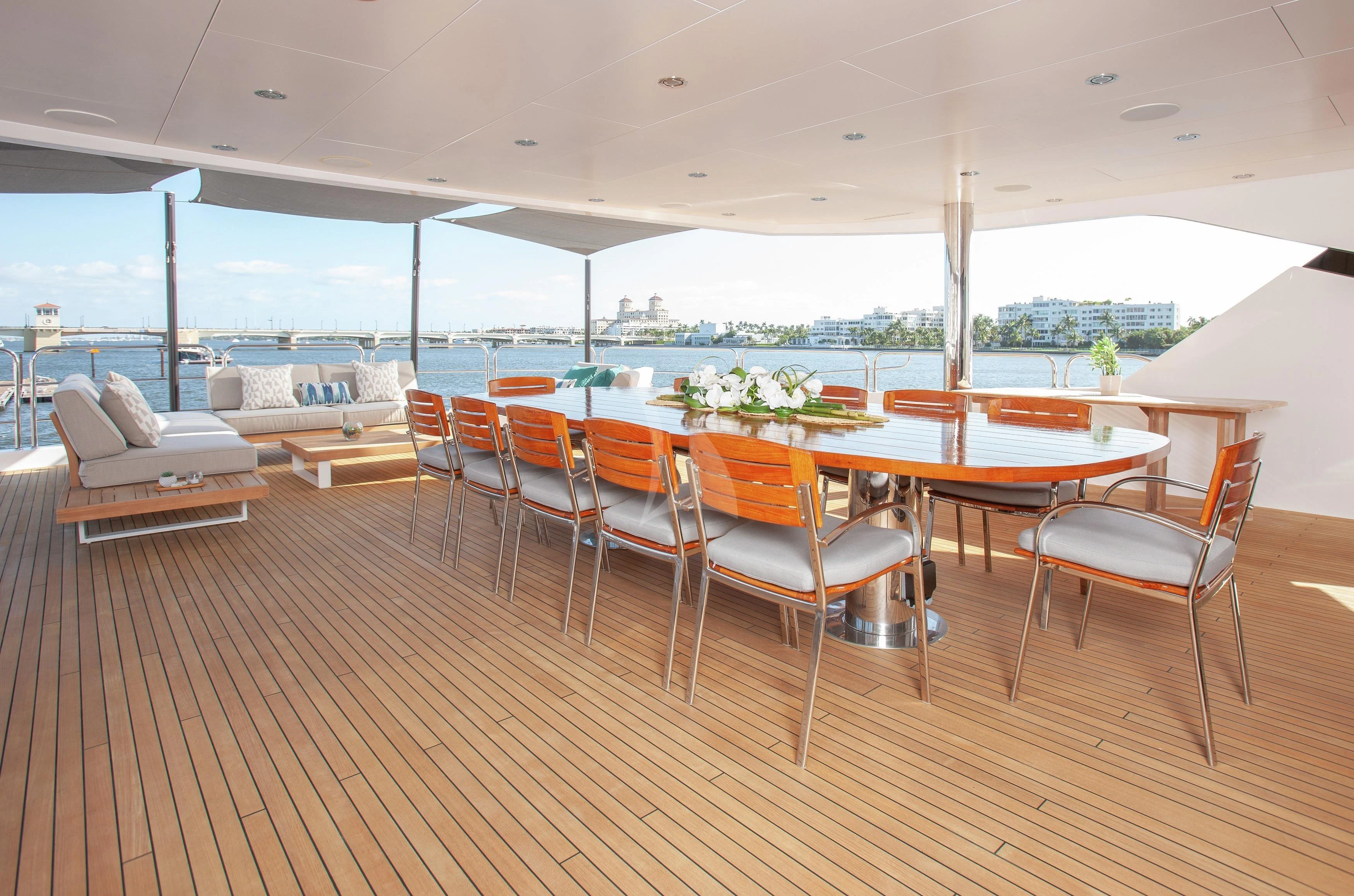 a room with a table and chairs aboard ALESSANDRA III Yacht for Charter