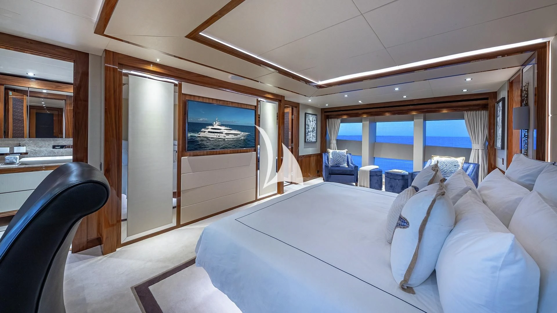 a room with a bed and a desk aboard ALESSANDRA III Yacht for Charter