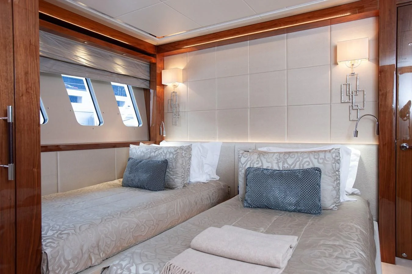 a bed with pillows aboard ALESSANDRA III Yacht for Charter
