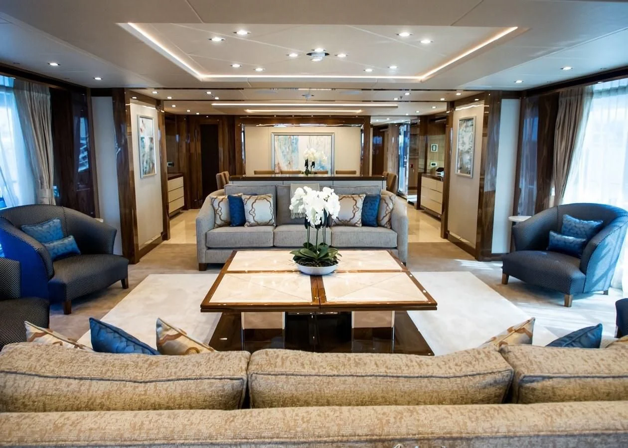 a living room with a couch and a coffee table aboard ALESSANDRA III Yacht for Charter