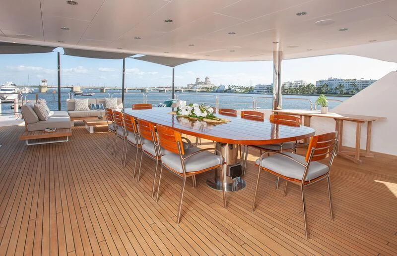 a table and chairs on a deck aboard ALESSANDRA III Yacht for Charter
