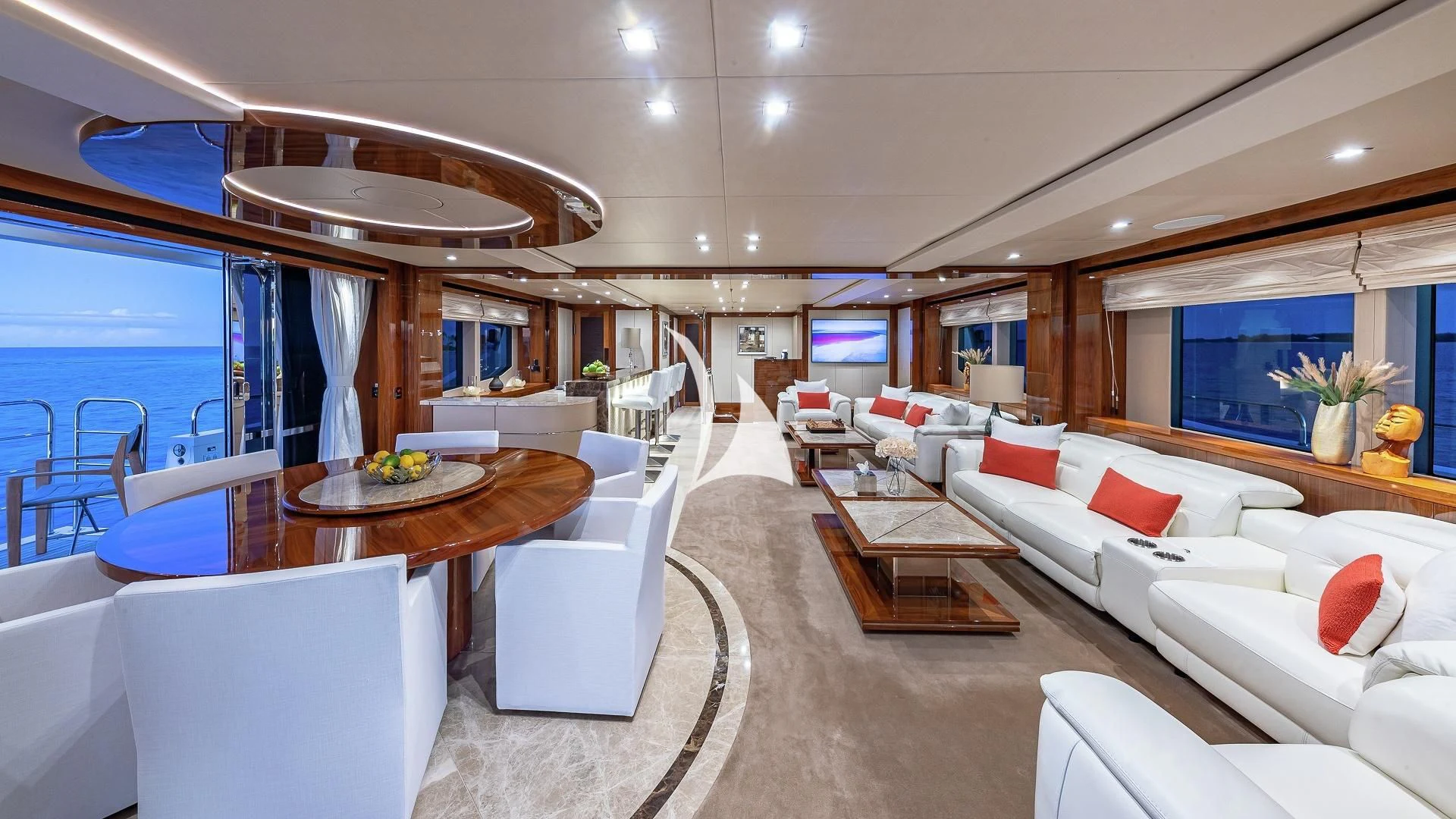 a living room with a large glass window aboard ALESSANDRA III Yacht for Charter