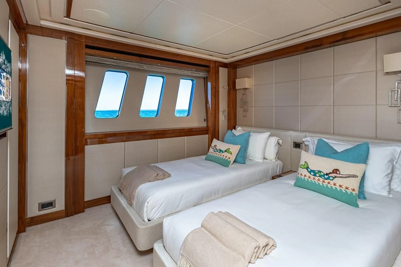 a room with a bed and a window aboard ALESSANDRA III Yacht for Charter