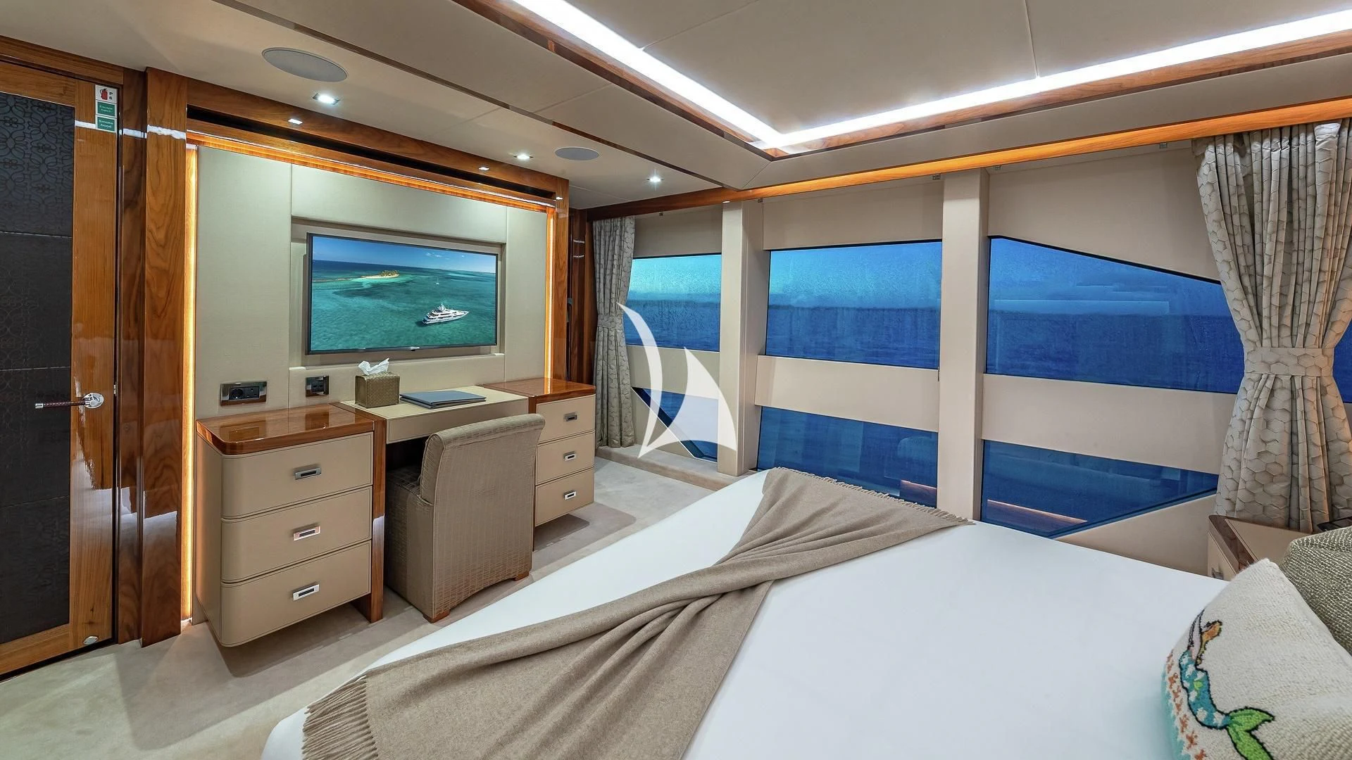 a hotel room with a bed and a tv aboard ALESSANDRA III Yacht for Charter