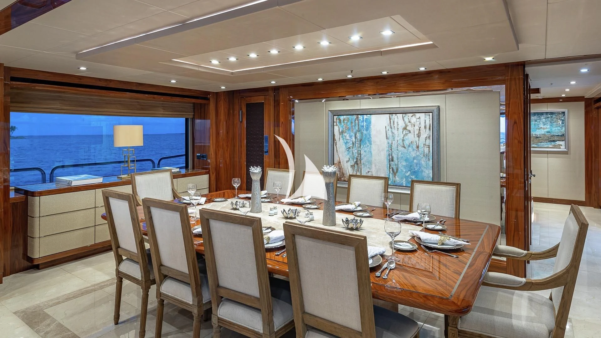 a large dining table with chairs aboard ALESSANDRA III Yacht for Charter