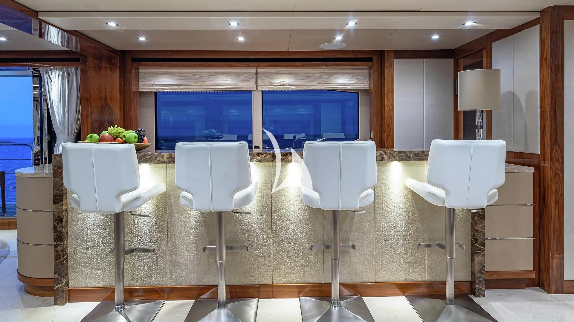 white chairs in a room aboard ALESSANDRA III Yacht for Charter
