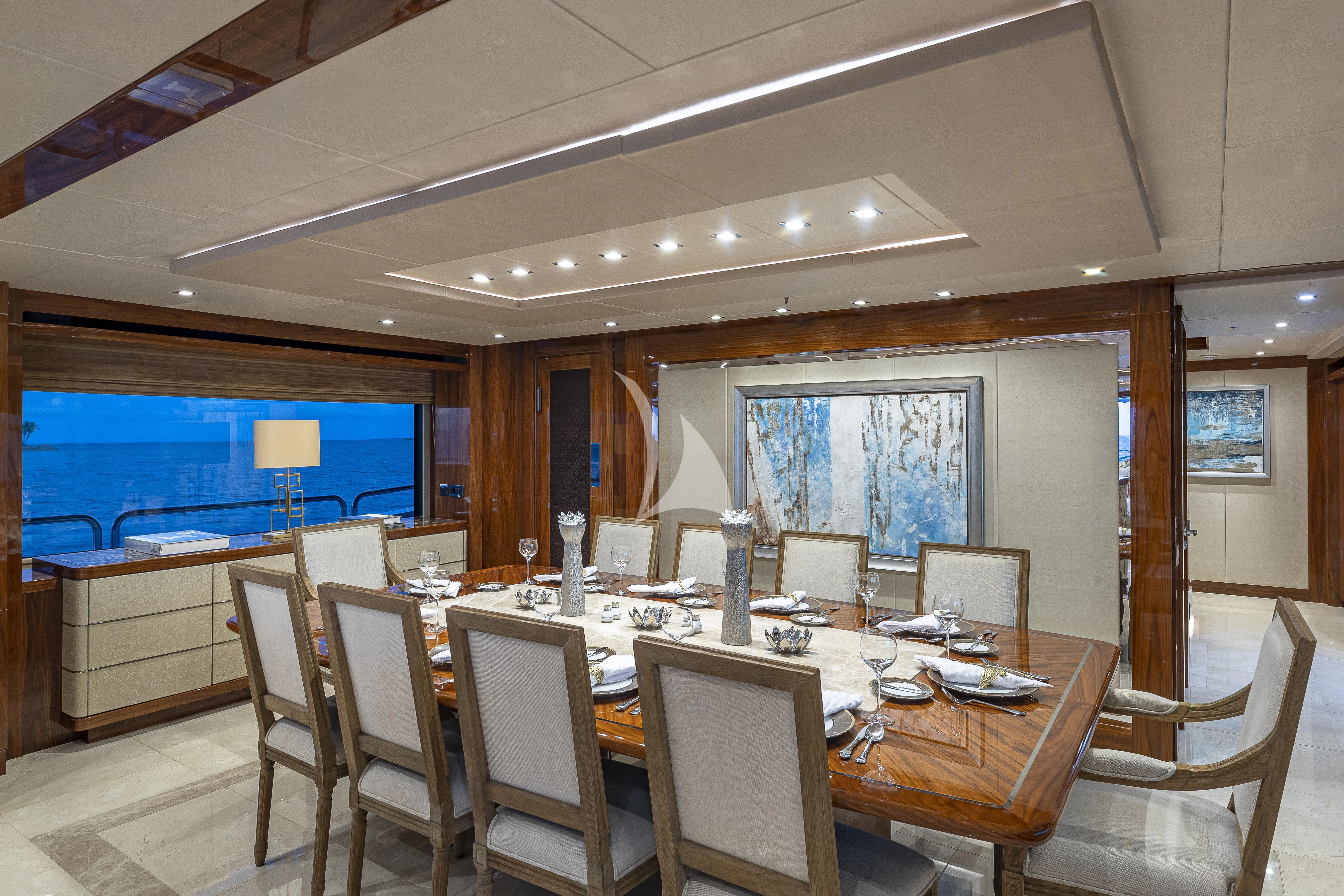 a conference room with tables and chairs aboard ALESSANDRA III Yacht for Charter