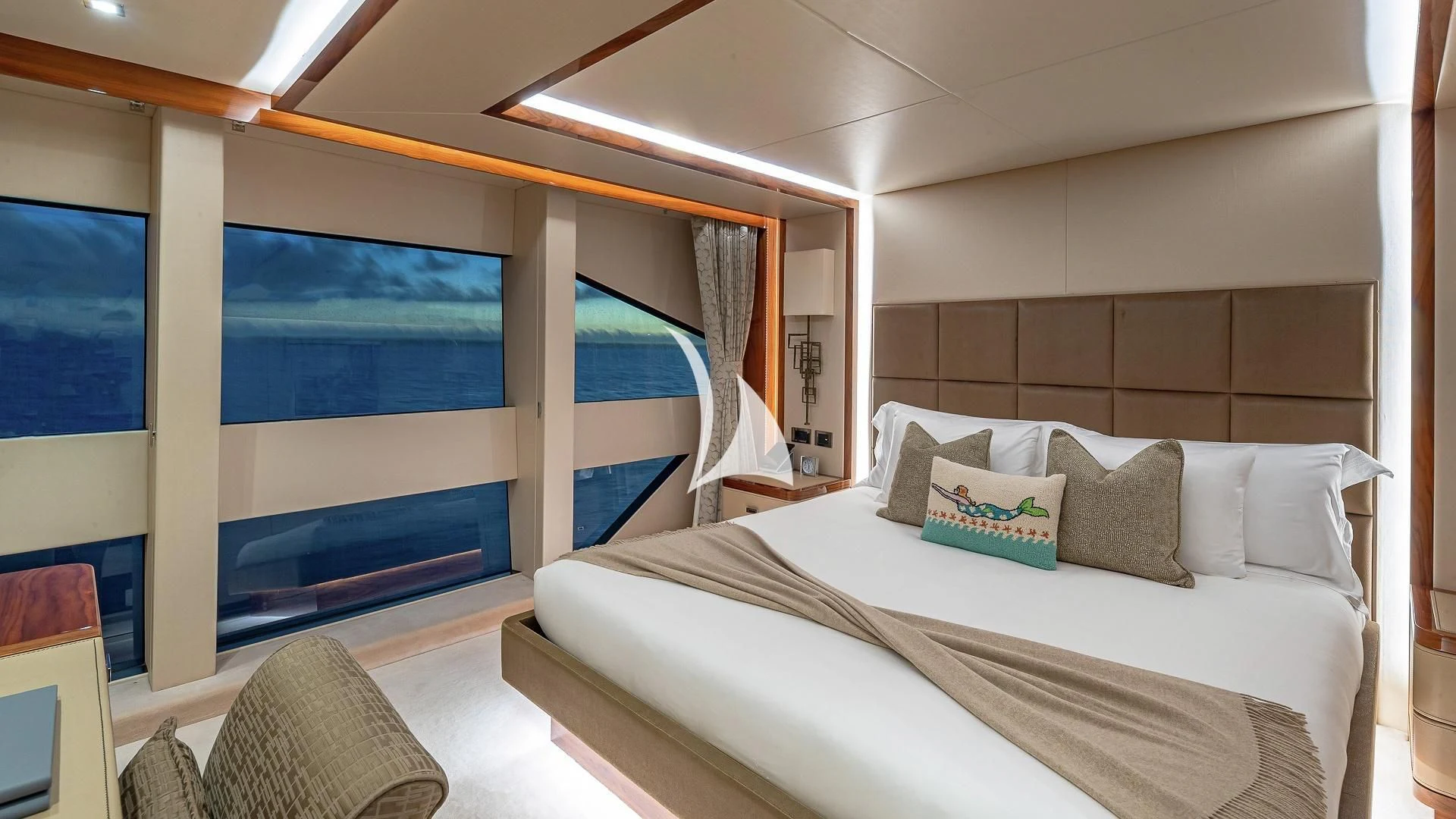 a room with a bed and a large window aboard ALESSANDRA III Yacht for Charter