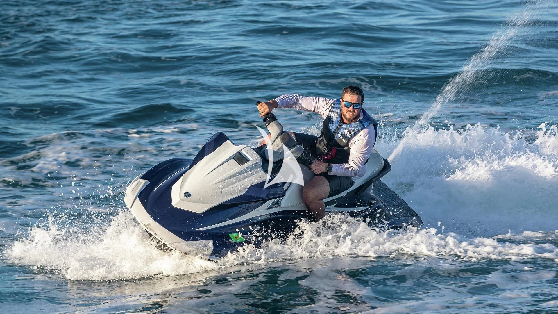 a man riding a jet ski aboard ALESSANDRA III Yacht for Charter