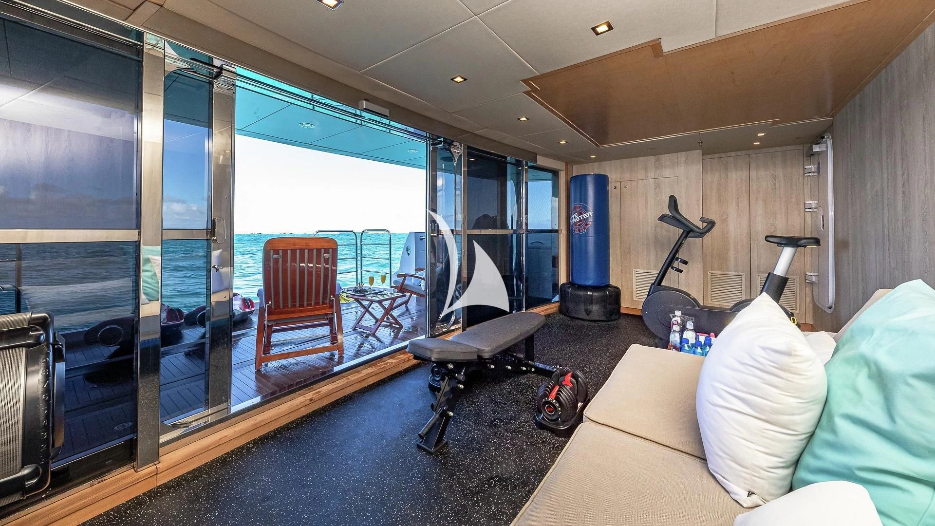 a room with a large glass wall aboard ALESSANDRA III Yacht for Charter