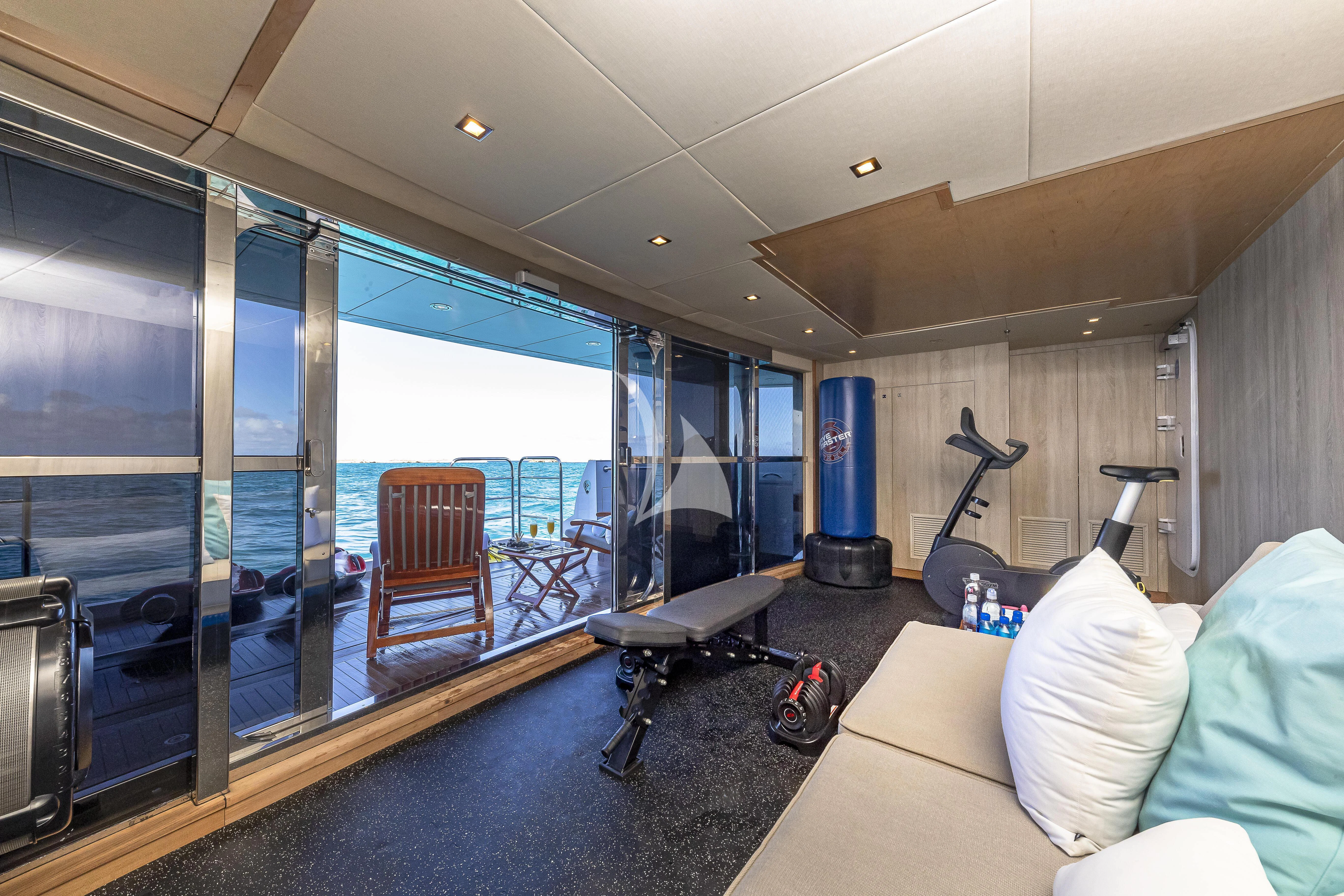 a room with a large glass window aboard ALESSANDRA III Yacht for Charter