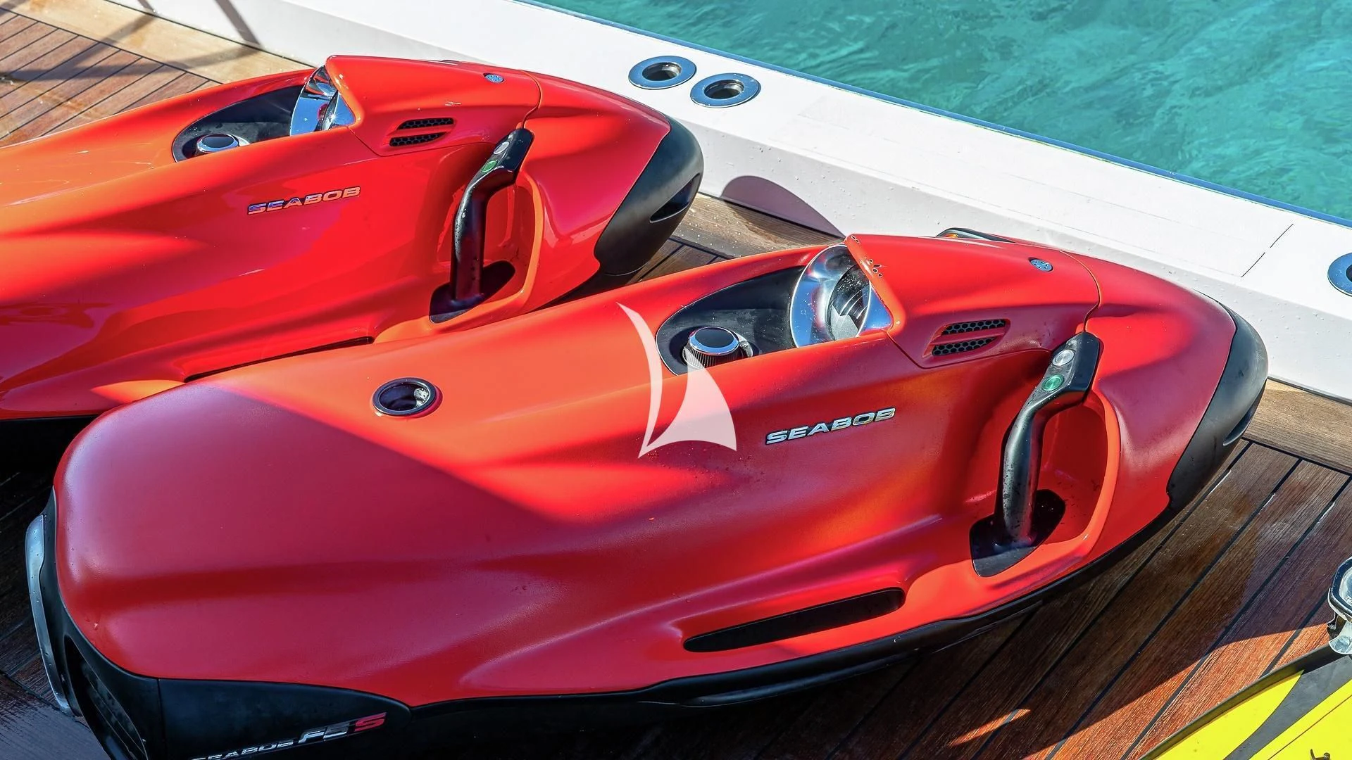 a red sports car aboard ALESSANDRA III Yacht for Charter