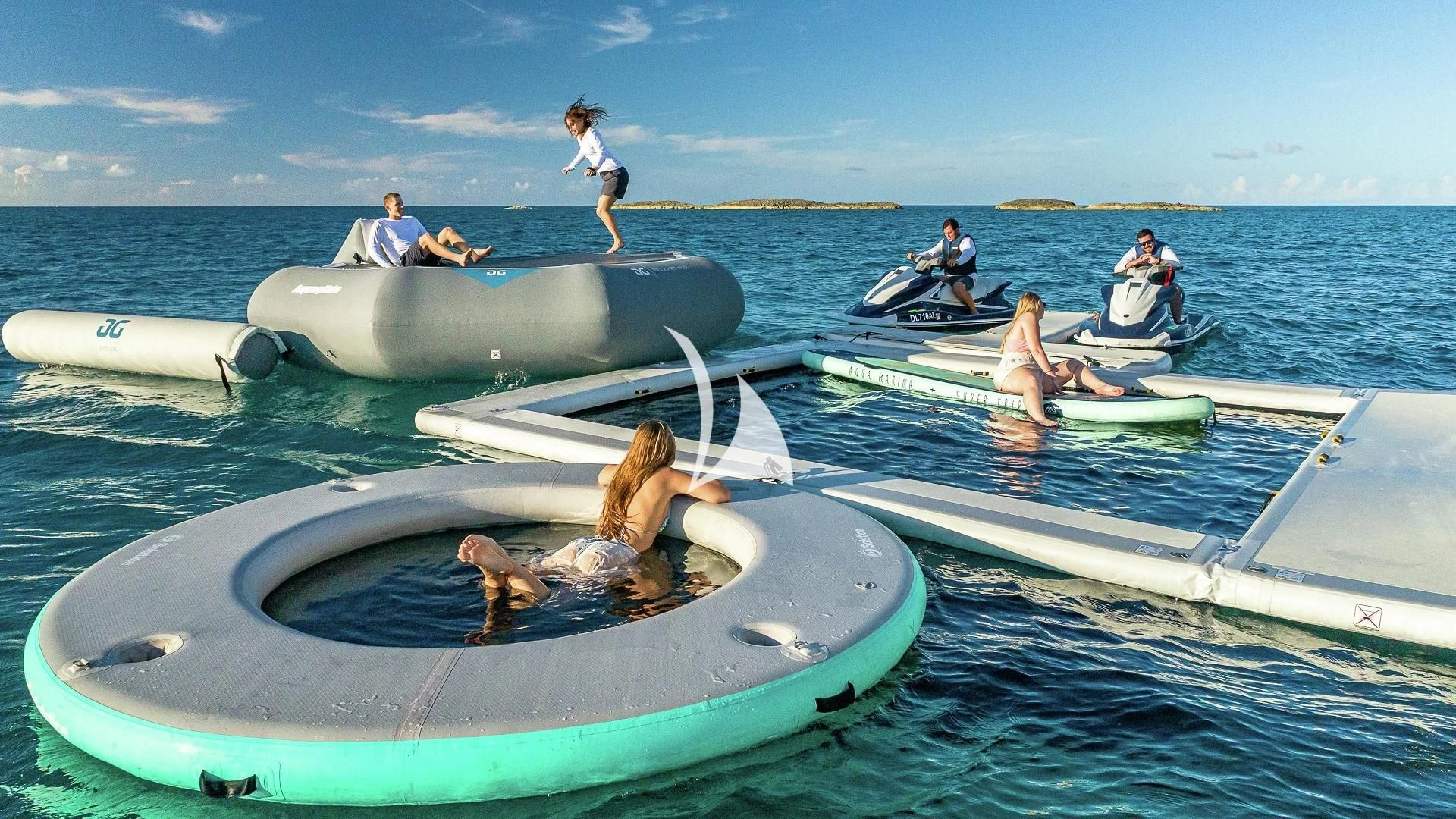 a group of people in a rowboat on the water aboard ALESSANDRA III Yacht for Charter