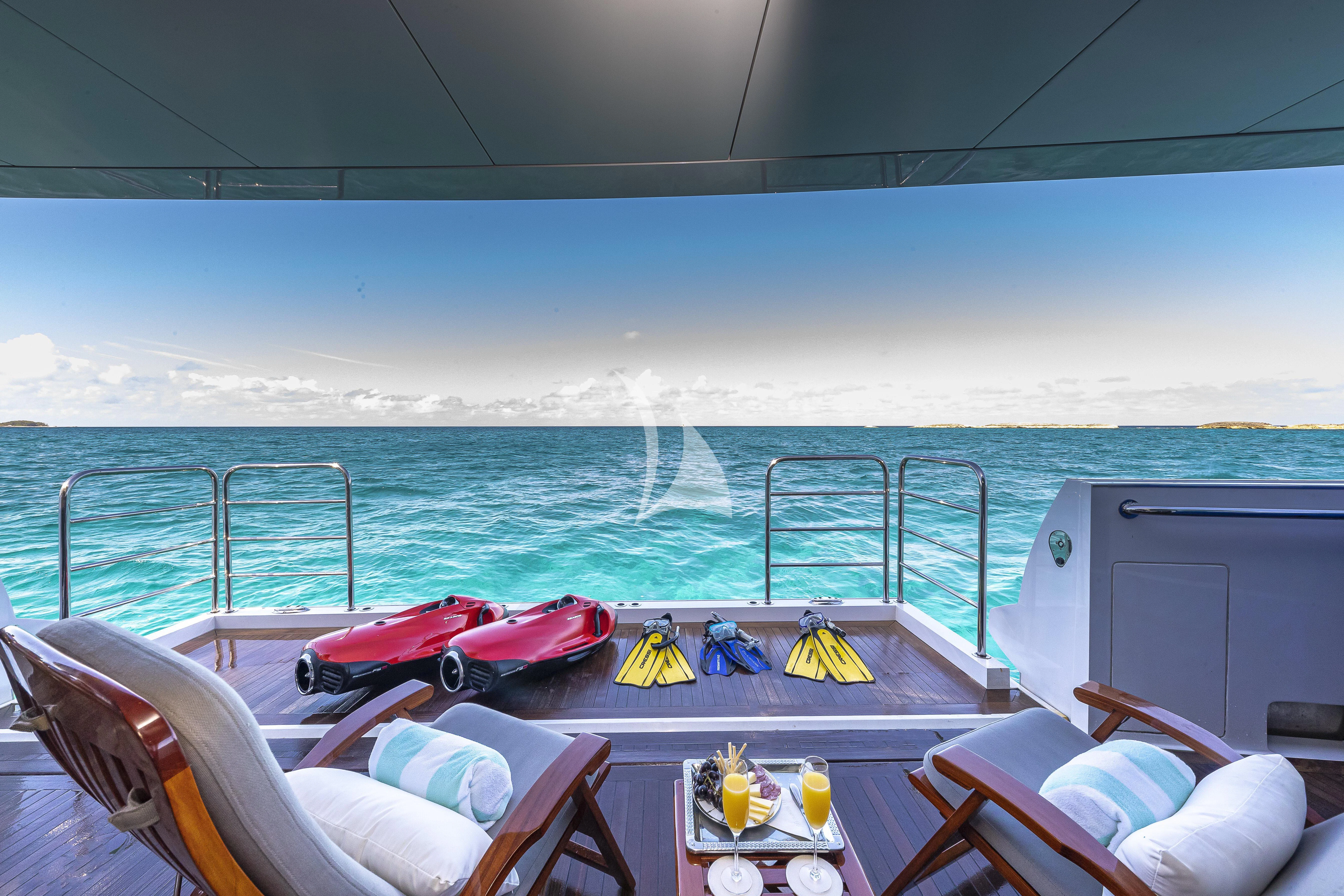 a boat with a couple of kayaks on it aboard ALESSANDRA III Yacht for Charter