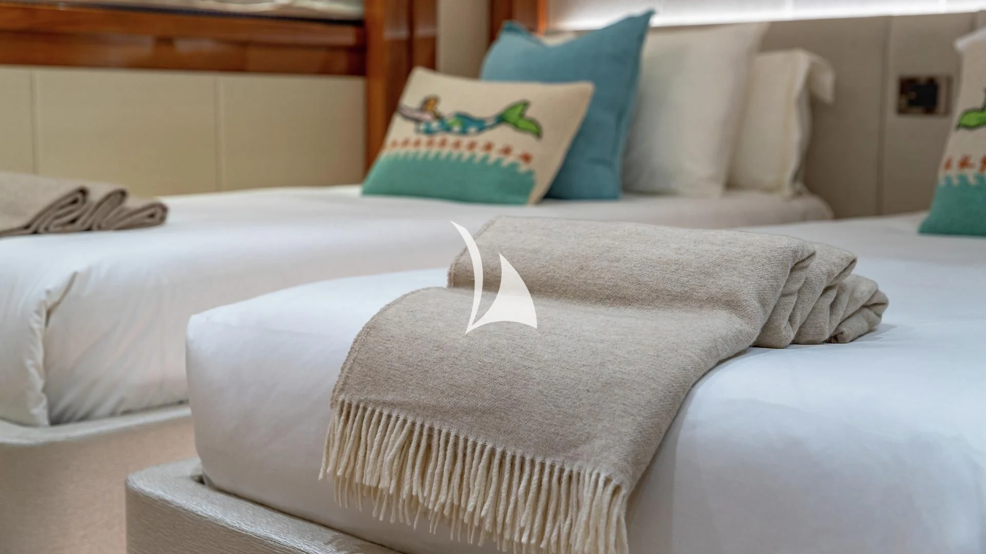 a bed with pillows aboard ALESSANDRA III Yacht for Charter