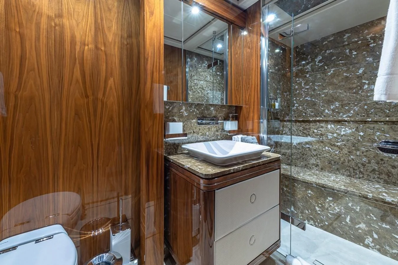 a bathroom with a sink and a mirror aboard ALESSANDRA III Yacht for Charter