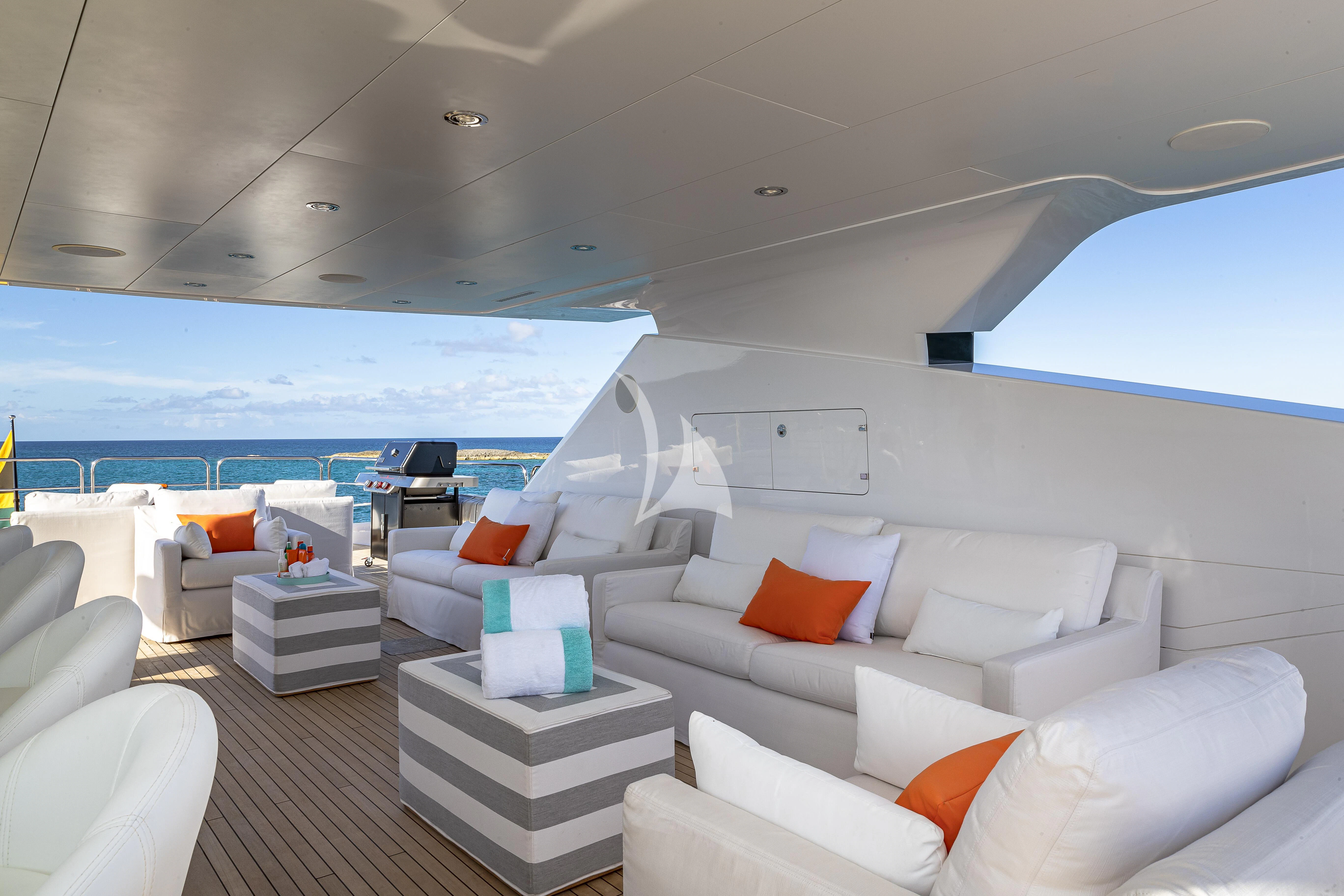 a room with a couch and a table aboard ALESSANDRA III Yacht for Charter