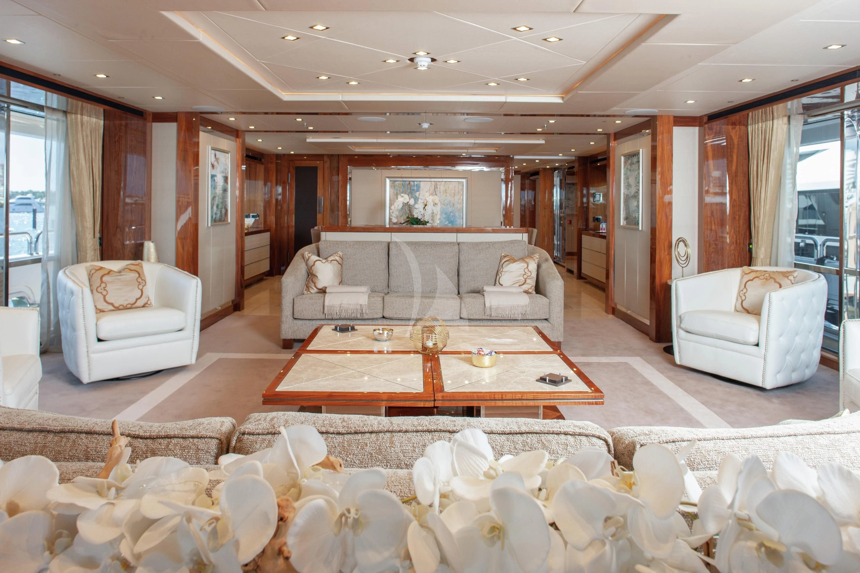 a living room with a couch and a table aboard ALESSANDRA III Yacht for Charter