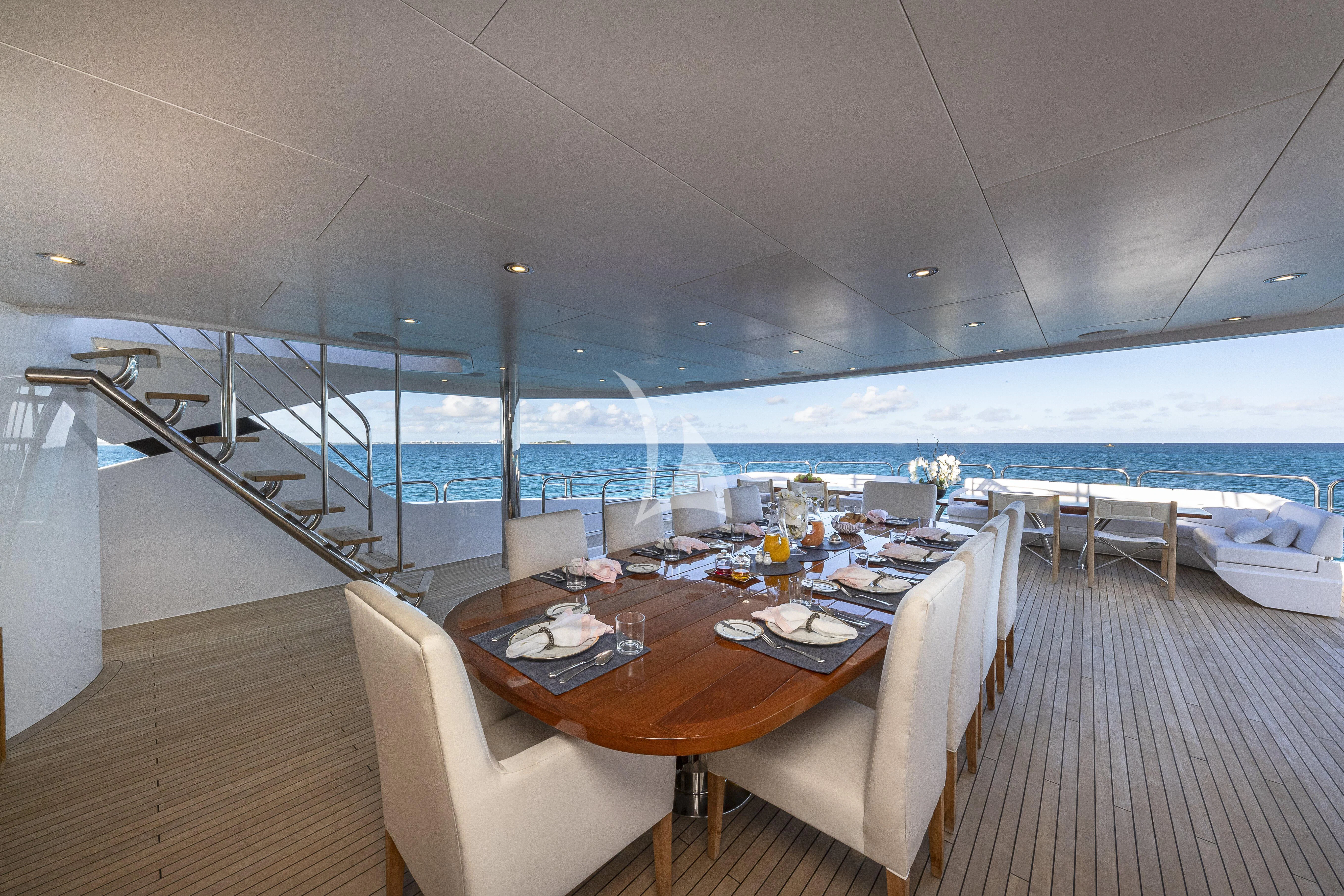 a room with a table and chairs aboard ALESSANDRA III Yacht for Charter