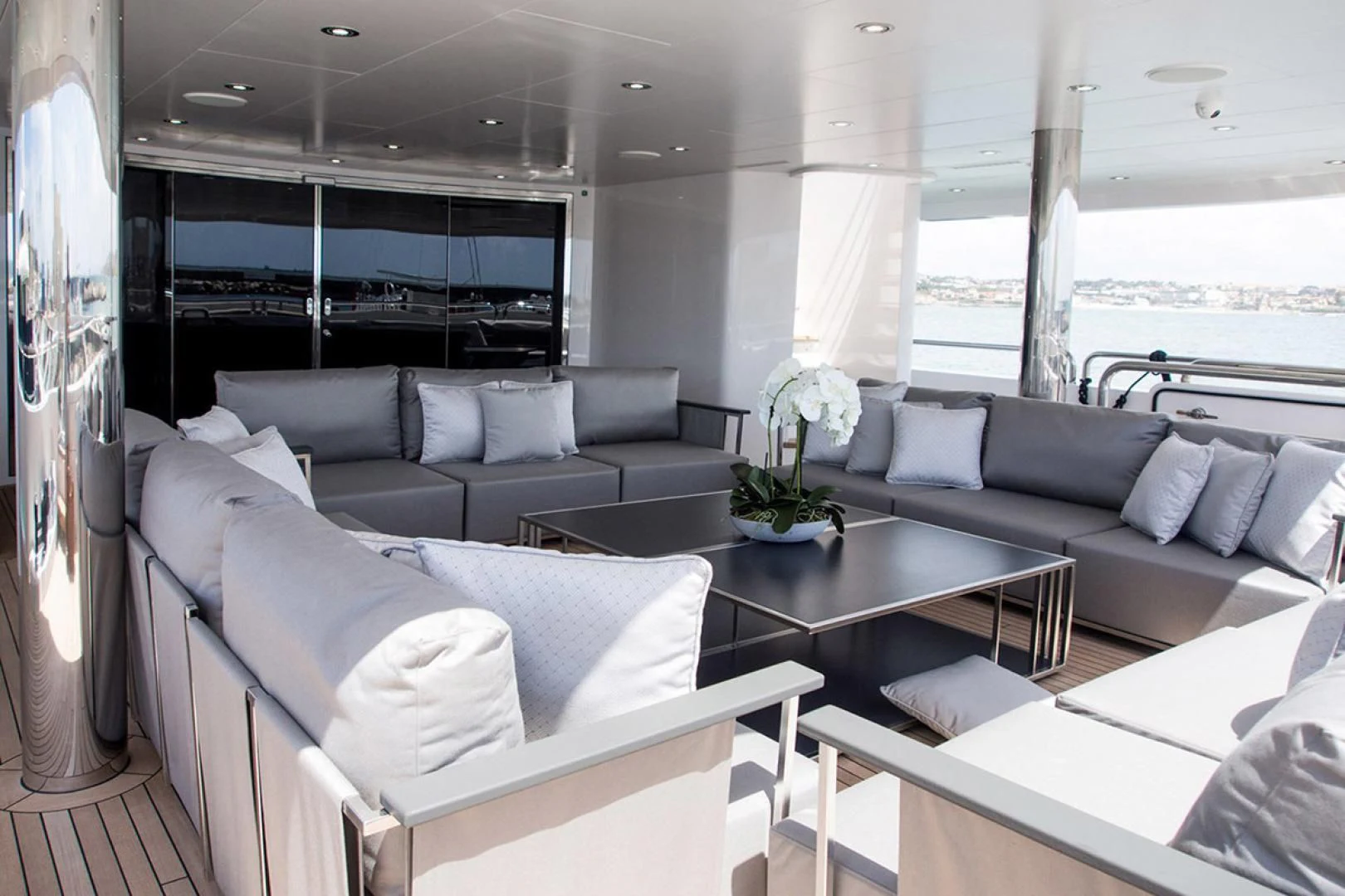 a living room with a large window aboard ALESSANDRA III Yacht for Charter
