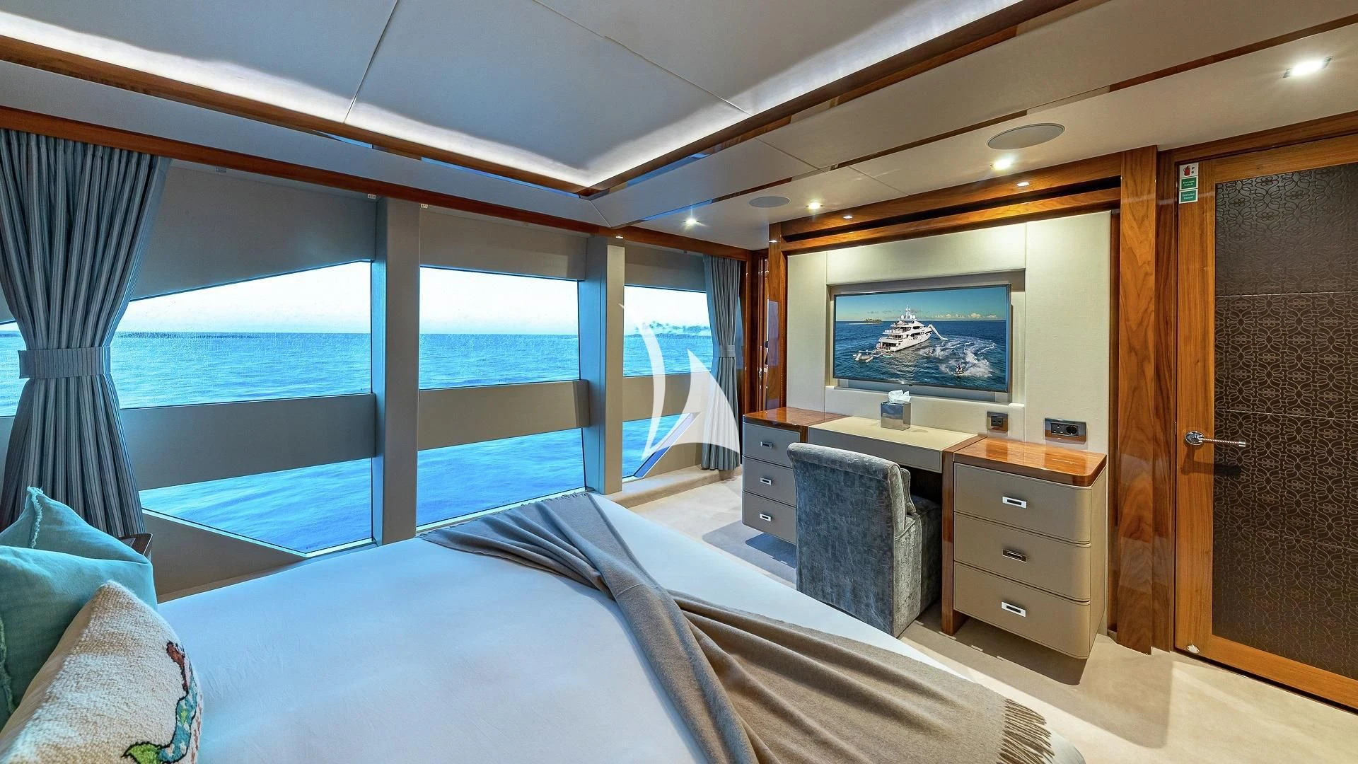 a room with a bed and a tv on the wall aboard ALESSANDRA III Yacht for Charter