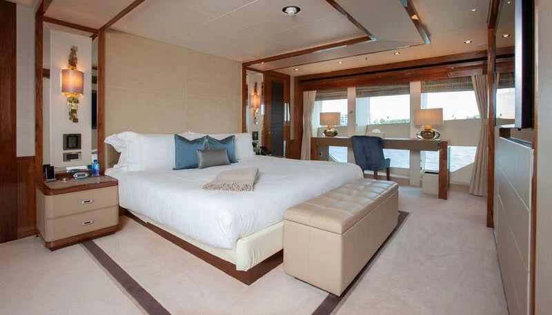a large bed in a room aboard ALESSANDRA III Yacht for Charter