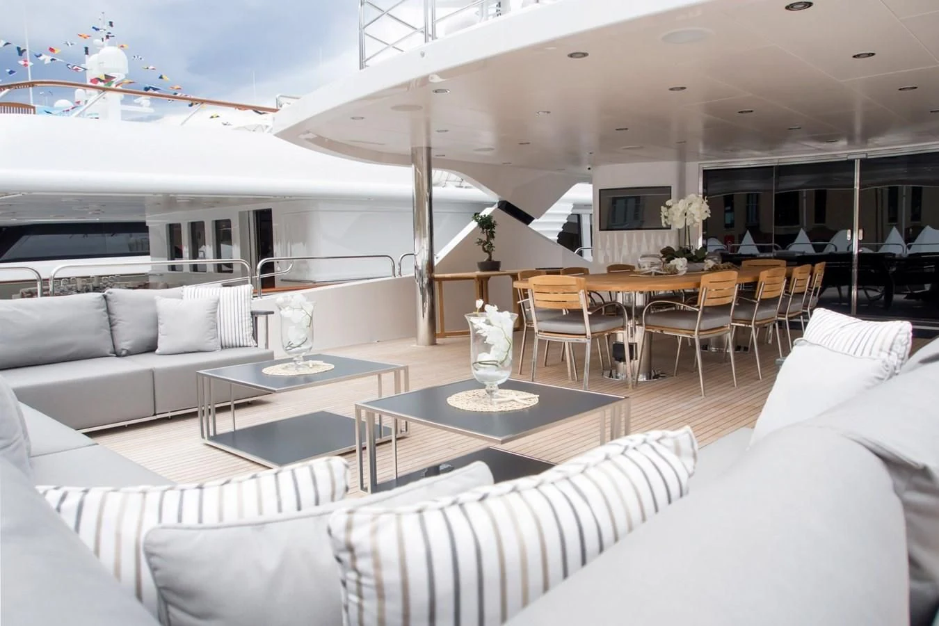 a living room with a table and couches aboard ALESSANDRA III Yacht for Charter