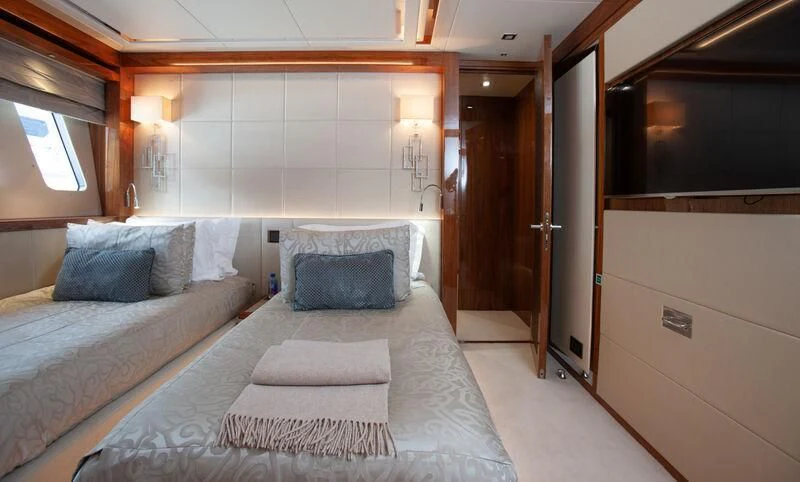 a bed in a room aboard ALESSANDRA III Yacht for Charter
