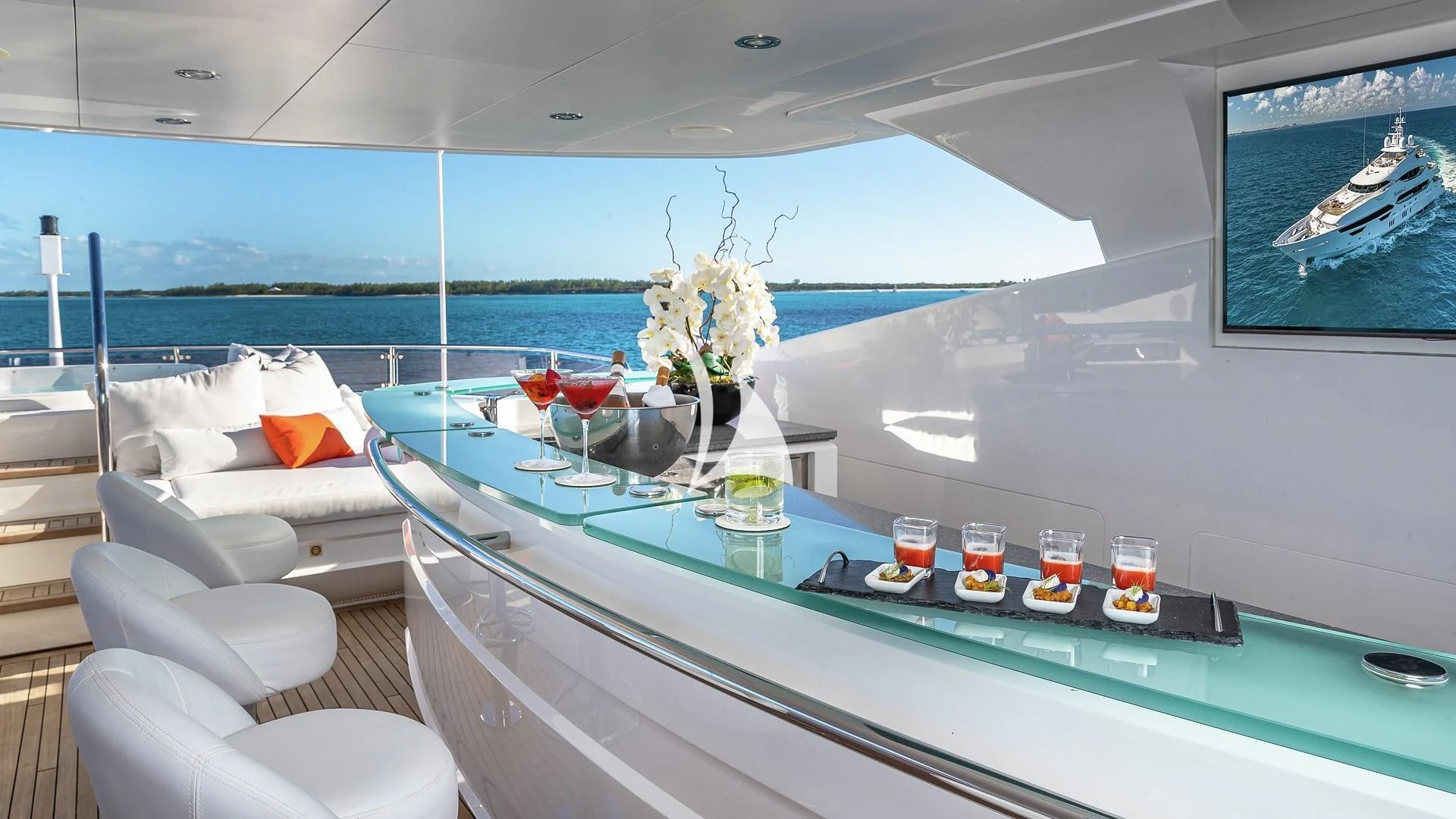 a table with drinks and candles on it aboard ALESSANDRA III Yacht for Charter