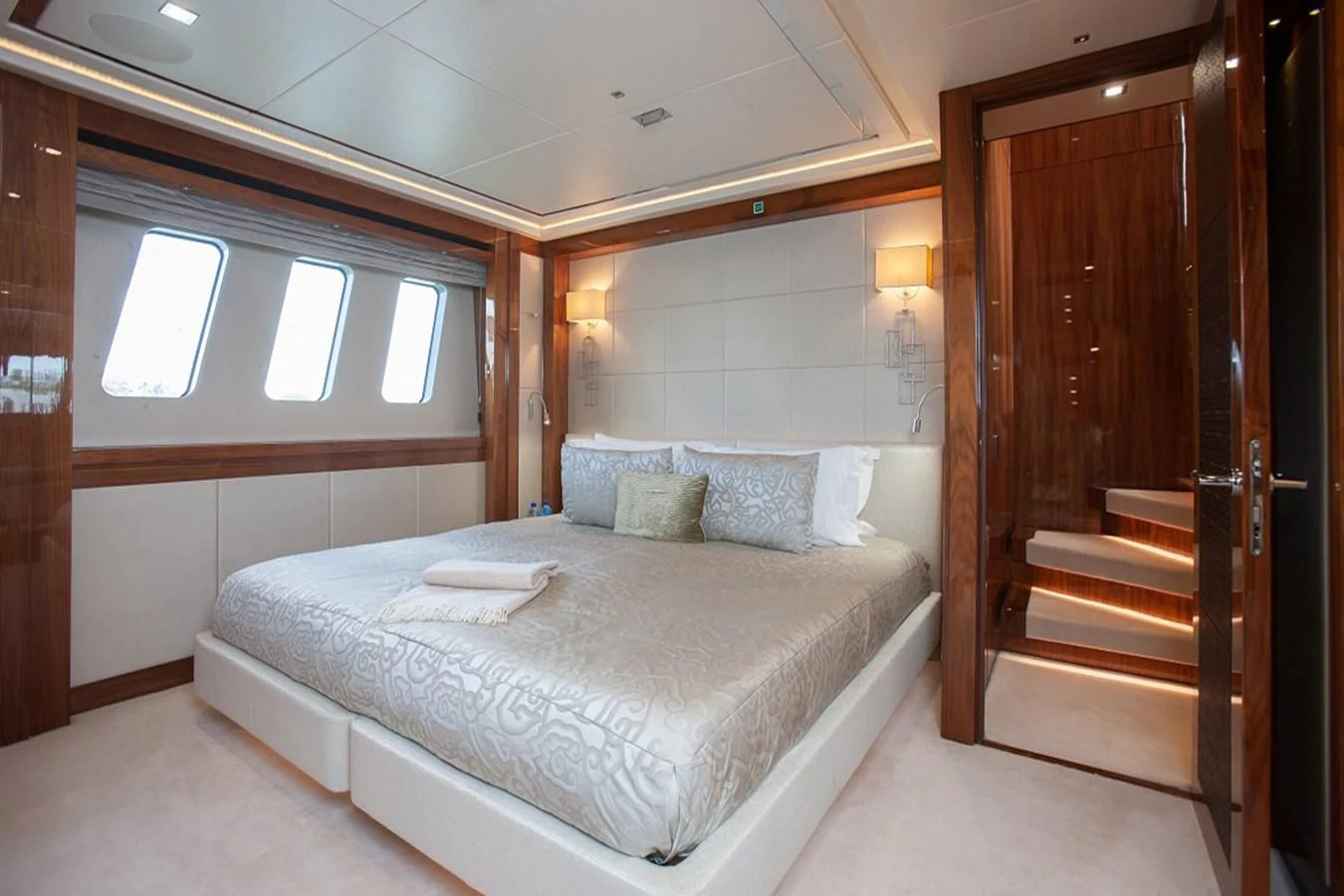 a bed in a room aboard ALESSANDRA III Yacht for Charter