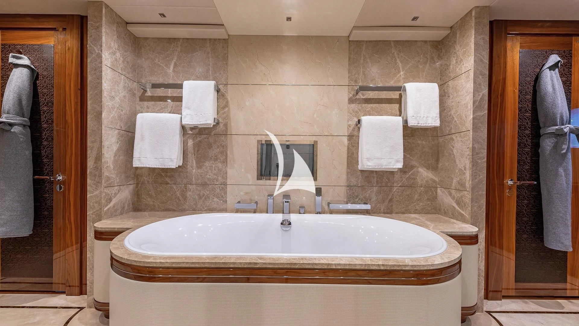 a bathroom with a sink and towels aboard ALESSANDRA III Yacht for Charter
