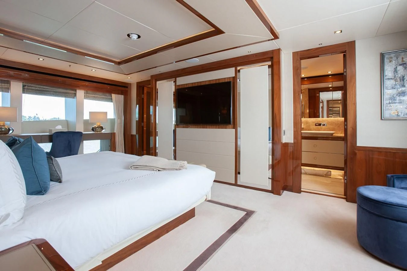 a bedroom with a bed and a desk aboard ALESSANDRA III Yacht for Charter